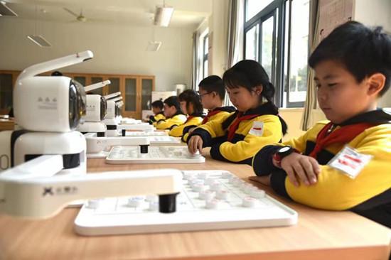 九游娱乐平台：沪上首家“元萝卜人工智能象棋试点学校”揭牌(图2)